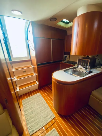  Yacht Photos Pics Interior of 1999 Tiara Yachts 43 Open, featuring wood cabinetry and modern kitchen amenities.