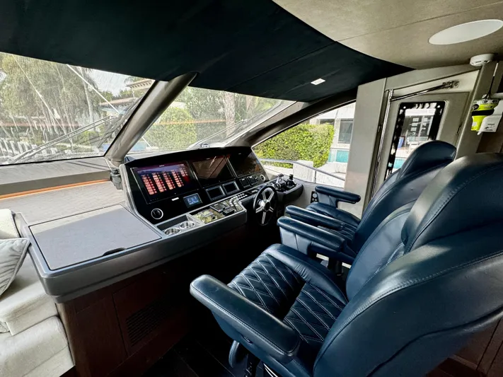 Journey Yacht Photos Pics Interior helm of 2019 Sunseeker 76 Yacht with modern controls and leather seating.
