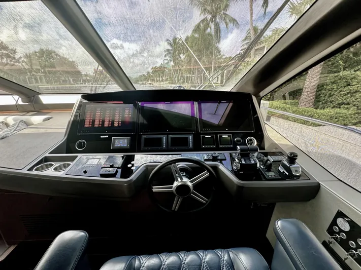 Journey Yacht Photos Pics Cockpit of 2019 Sunseeker 76 Yacht with advanced navigation controls and panoramic view.