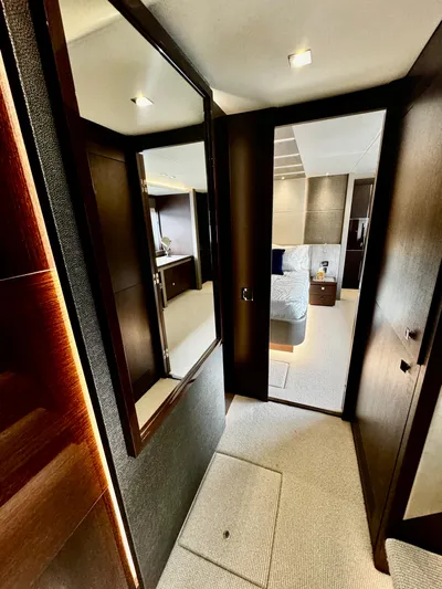 Journey Yacht Photos Pics Luxurious interior of 2019 Sunseeker 76 Yacht, featuring elegant wood finishes and modern design.