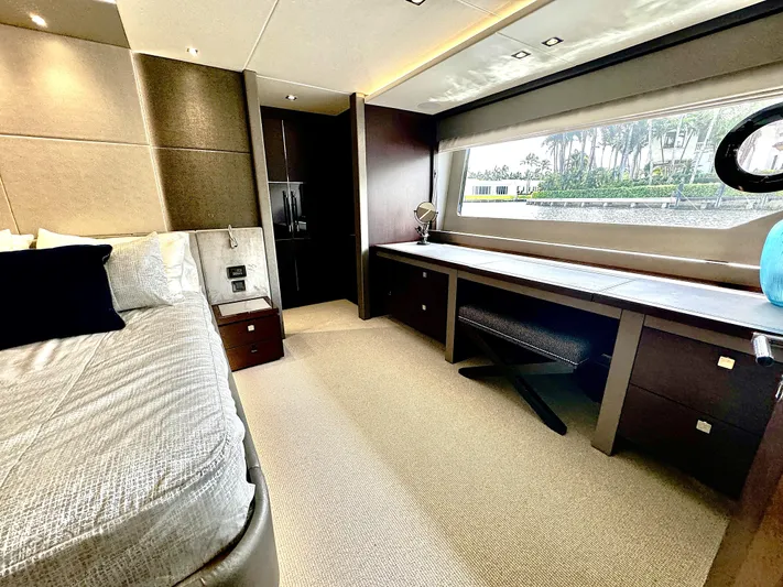 Journey Yacht Photos Pics Luxurious interior of 2019 Sunseeker 76 Yacht with elegant bedroom and scenic window view.