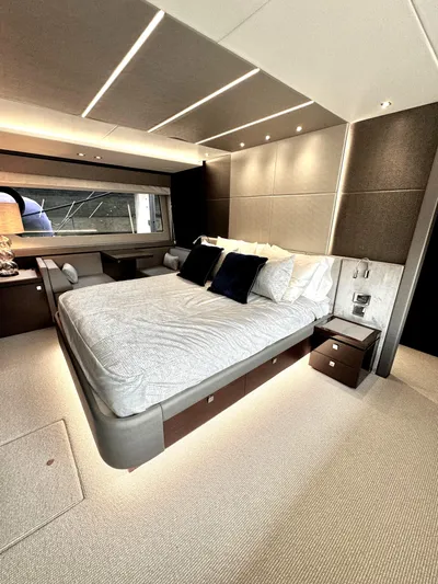 Journey Yacht Photos Pics Luxurious bedroom interior of 2019 Sunseeker 76 Yacht with modern design and ambient lighting.