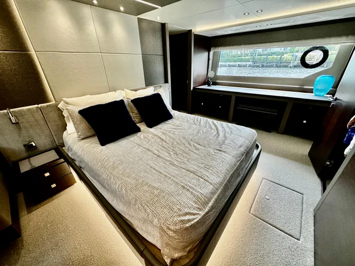 Journey Yacht Photos Pics Luxurious bedroom interior of 2019 Sunseeker 76 Yacht with modern design and large window.