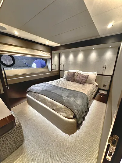 Journey Yacht Photos Pics Luxurious bedroom interior of 2019 Sunseeker 76 Yacht with modern design and ambient lighting.