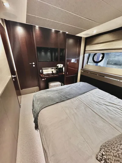 Journey Yacht Photos Pics Luxurious bedroom interior of 2019 Sunseeker 76 Yacht with modern furnishings and elegant design.