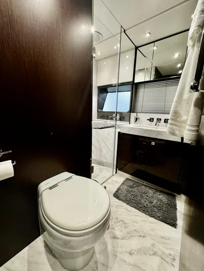 Journey Yacht Photos Pics Luxurious bathroom in 2019 Sunseeker 76 Yacht with modern fixtures and elegant design.