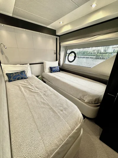 Journey Yacht Photos Pics Luxurious twin bedroom on 2019 Sunseeker 76 Yacht with modern decor and large window.