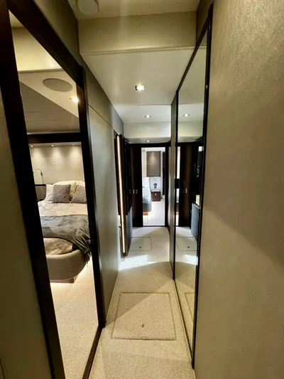 Journey Yacht Photos Pics Luxurious interior hallway of a 2019 Sunseeker 76 Yacht, featuring elegant design and modern lighting.