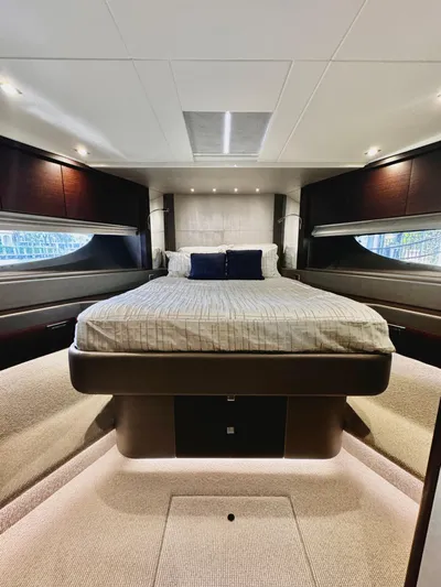 Journey Yacht Photos Pics Luxurious bedroom interior of 2019 Sunseeker 76 Yacht with modern design and cozy ambiance.