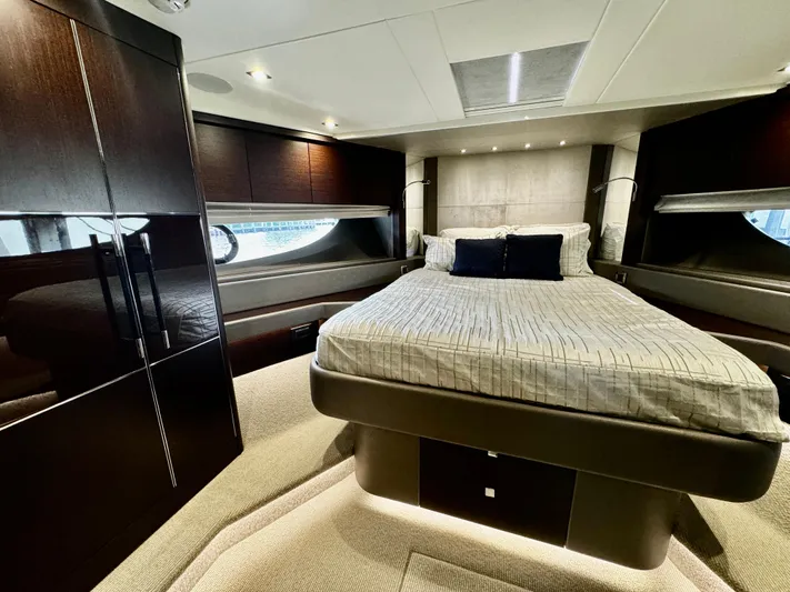 Journey Yacht Photos Pics Luxurious bedroom interior of 2019 Sunseeker 76 Yacht with modern design and elegant furnishings.