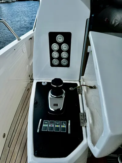 Journey Yacht Photos Pics Control panel of a 2019 Sunseeker 76 Yacht, featuring joystick and buttons.