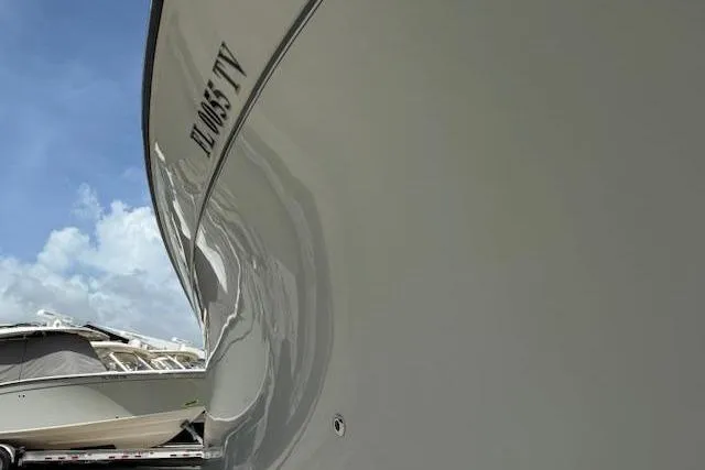 335-514 Brokerage Ron Yacht Photos Pics 2023 Grady-White Freedom 335 boat hull with clear sky background.