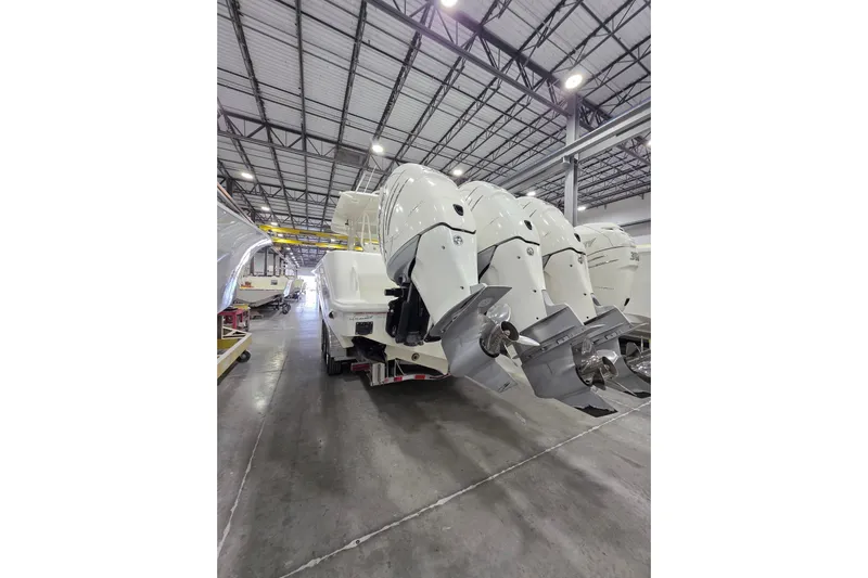 Seavee Yacht Photos Pics 2017 SeaVee 390Z boat with multiple outboard engines in a warehouse setting.