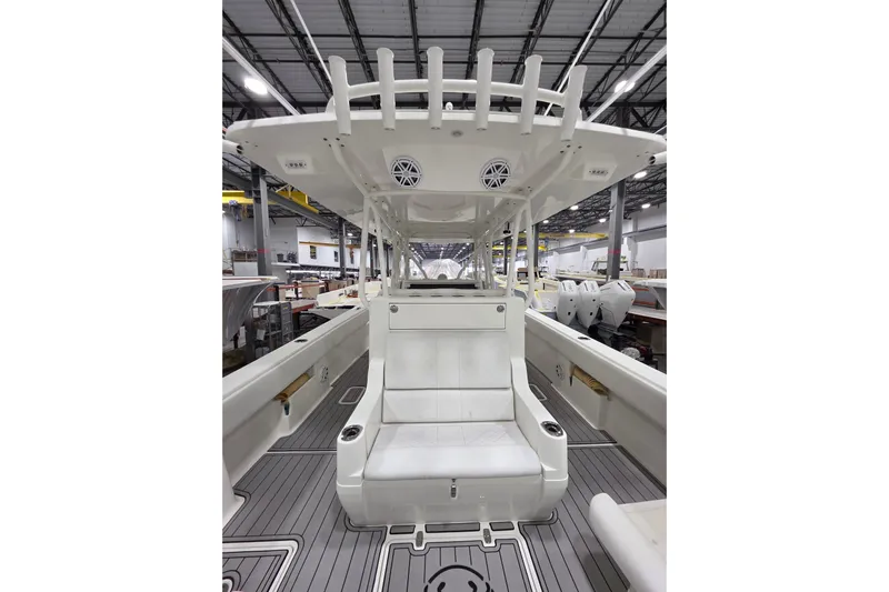 Seavee Yacht Photos Pics 2017 SeaVee 390Z boat interior with seating and rod holders in a spacious warehouse.