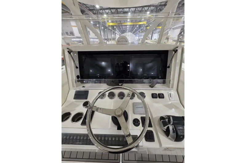 Seavee Yacht Photos Pics 2017 SeaVee 390Z boat dashboard with steering wheel and navigation controls.