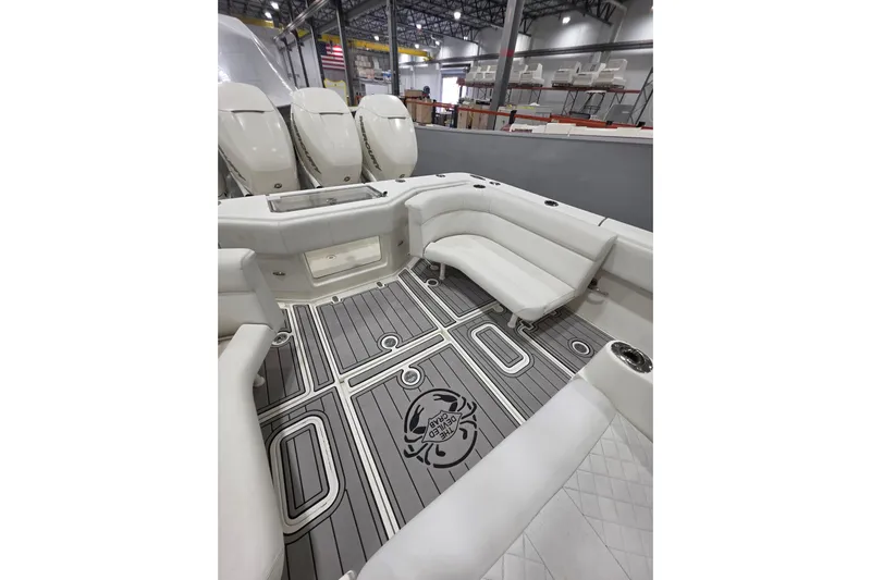 Seavee Yacht Photos Pics 2017 SeaVee 390Z boat interior with cushioned seating and stylish flooring design.