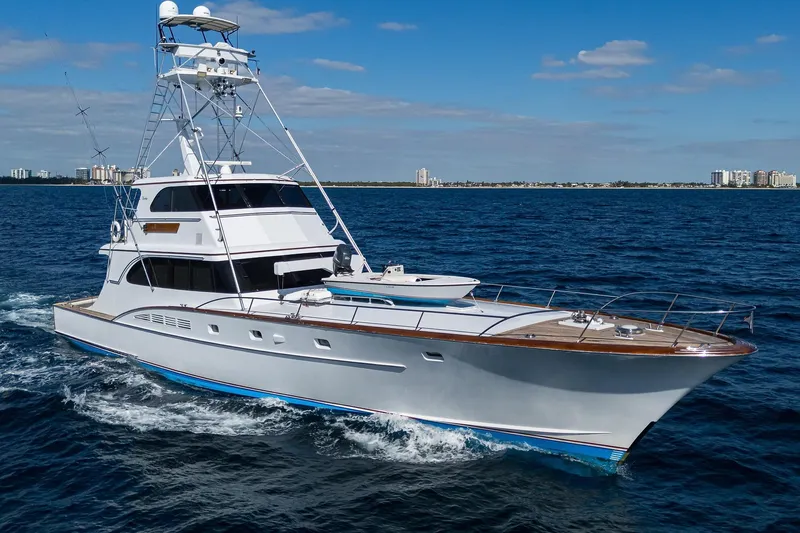  Yacht Photos Pics 1985 Feadship Yacht Fisherman cruising on open sea under clear blue sky.
