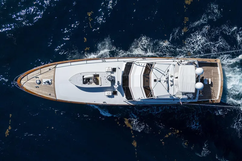  Yacht Photos Pics Aerial view of 1985 Feadship Yacht Fisherman cruising on open water.