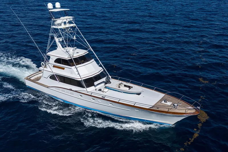  Yacht Photos Pics 1985 Feadship Yacht Fisherman cruising on open sea, showcasing elegant design and craftsmanship.