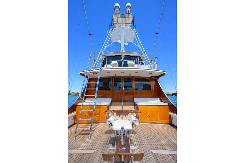  Yacht Photos Pics 1985 Feadship Yacht Fisherman with wooden deck and tower against clear blue sky.
