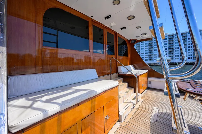  Yacht Photos Pics Luxurious 1985 Feadship Yacht Fisherman with elegant wooden deck and comfortable seating.