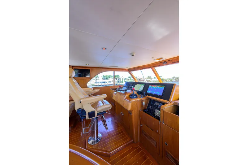  Yacht Photos Pics Luxurious 1985 Feadship Yacht Fisherman helm with modern navigation equipment and leather seating.