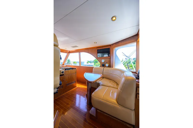  Yacht Photos Pics Luxurious interior of 1985 Feadship Yacht Fisherman with leather seating and wooden accents.