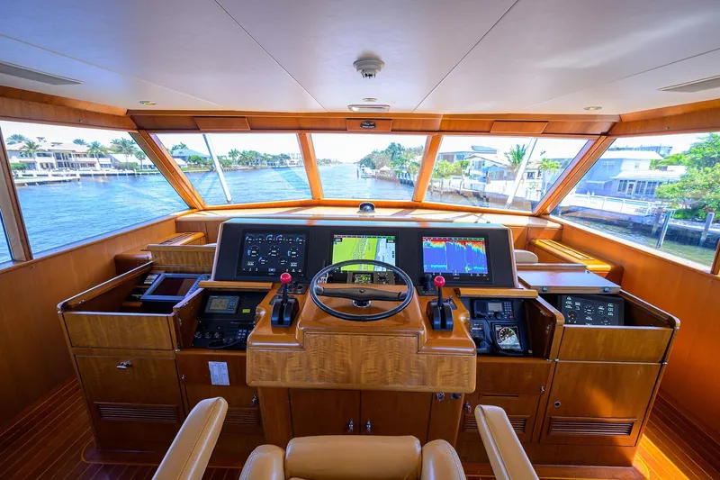  Yacht Photos Pics 1985 Feadship Yacht Fisherman helm with modern navigation equipment and panoramic waterway view.