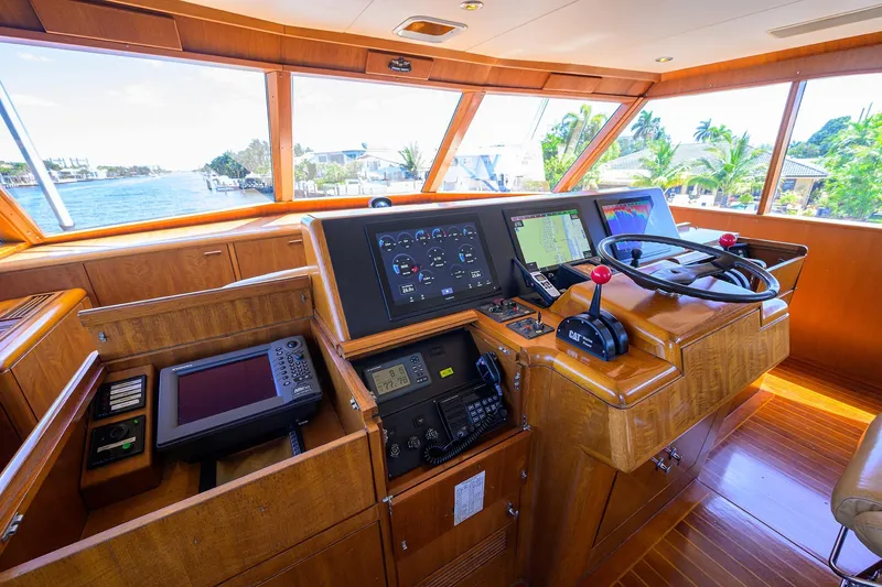  Yacht Photos Pics Cockpit of 1985 Feadship Yacht Fisherman with navigation equipment and wooden interior.