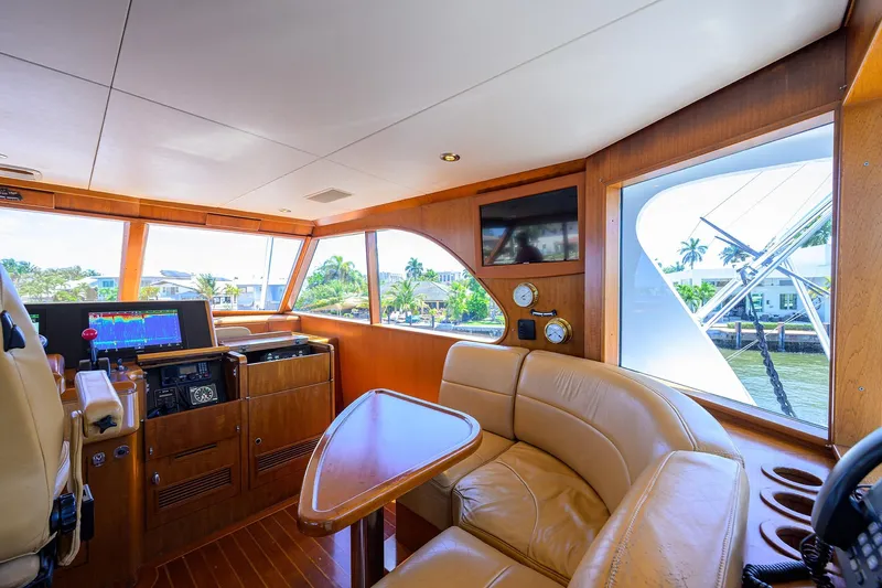  Yacht Photos Pics Luxurious 1985 Feadship Yacht Fisherman interior with leather seating and navigation equipment.