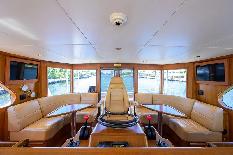  Yacht Photos Pics Luxurious 1985 Feadship Yacht Fisherman interior with leather seating and panoramic windows.