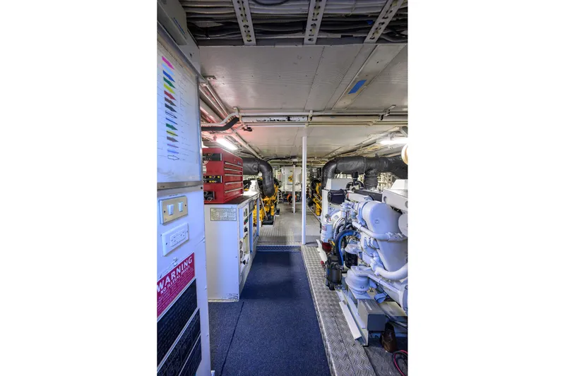  Yacht Photos Pics Engine room of 1985 Feadship Yacht Fisherman, featuring machinery and control panels.