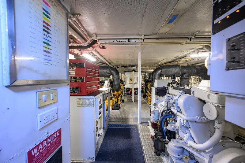  Yacht Photos Pics Engine room of 1985 Feadship Yacht Fisherman, featuring machinery and control panels.