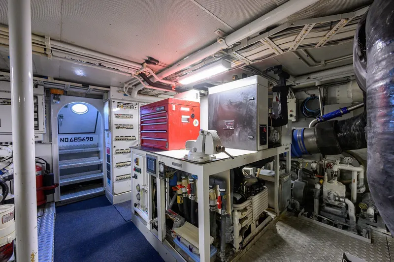  Yacht Photos Pics Engine room of 1985 Feadship Yacht Fisherman, featuring machinery and control panels.