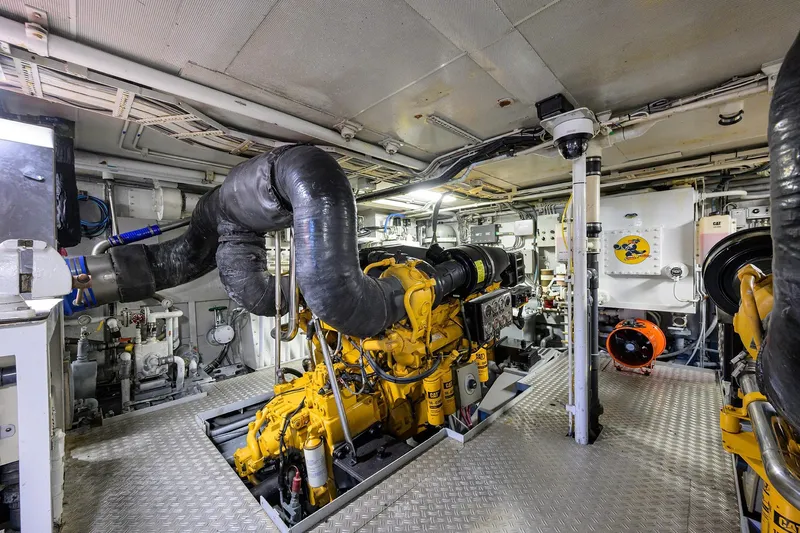  Yacht Photos Pics Engine room of 1985 Feadship Yacht Fisherman, featuring complex machinery and equipment.