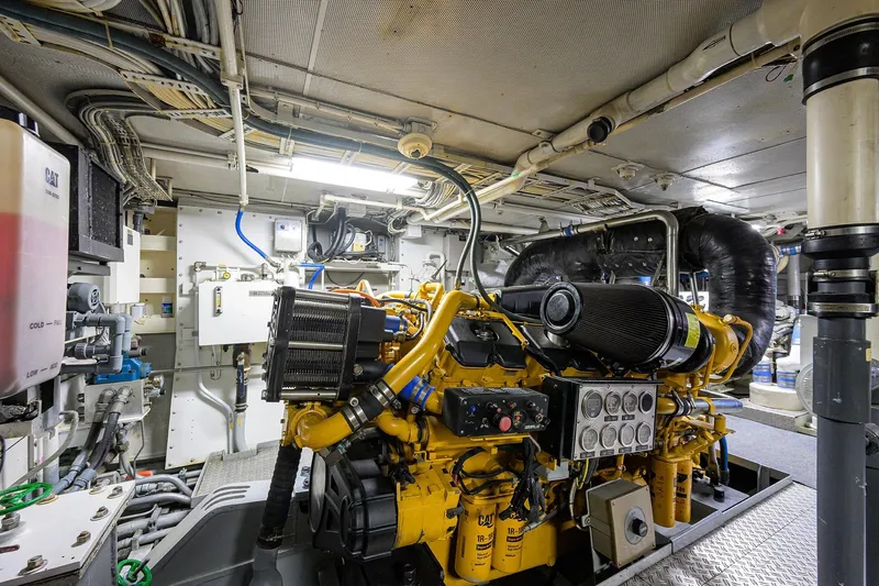  Yacht Photos Pics Engine room of 1985 Feadship Yacht Fisherman, showcasing complex machinery and wiring.