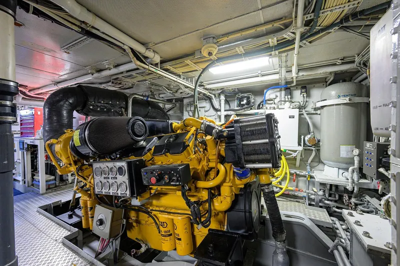  Yacht Photos Pics Engine room of 1985 Feadship Yacht Fisherman, showcasing machinery and equipment.