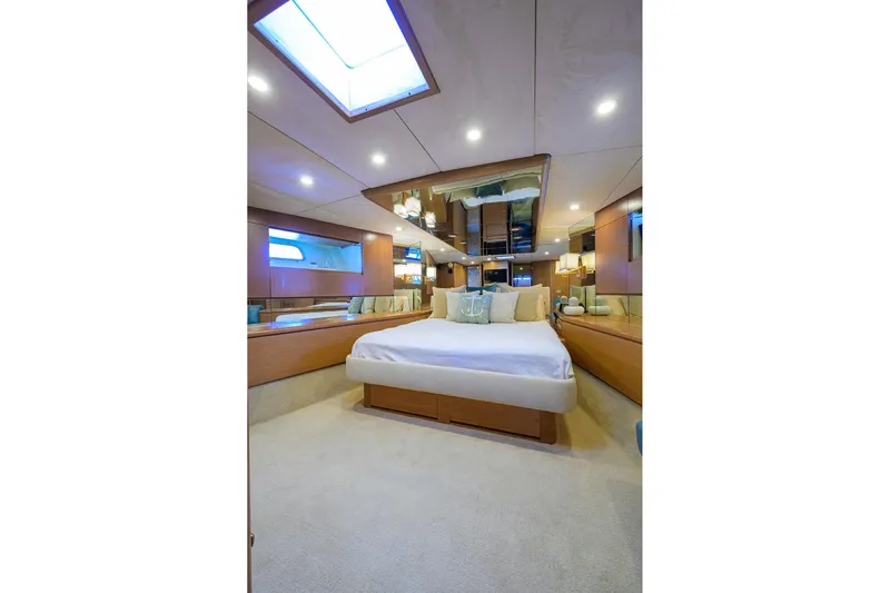  Yacht Photos Pics Luxurious bedroom interior of 1985 Feadship Yacht Fisherman with modern design and ambient lighting.