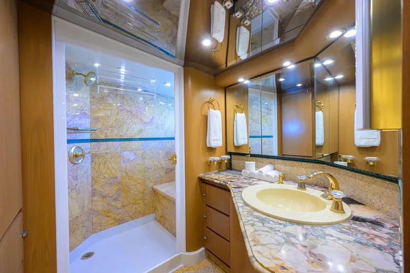  Yacht Photos Pics Luxurious 1985 Feadship Yacht Fisherman bathroom with marble shower and elegant fixtures.