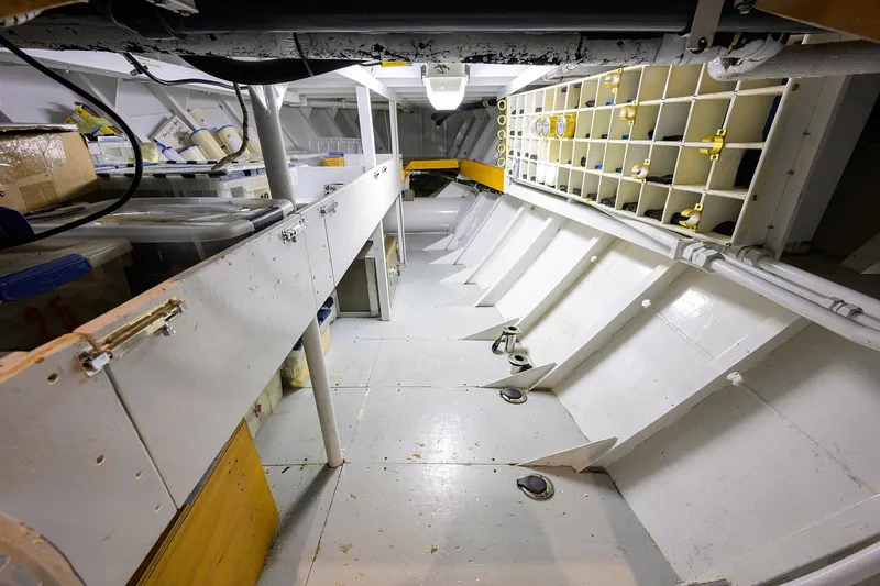  Yacht Photos Pics Interior of 1985 Feadship Yacht Fisherman, showcasing storage and structural details.