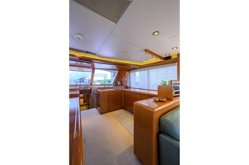  Yacht Photos Pics Luxurious interior of 1985 Feadship Yacht Fisherman with elegant wood finishes and modern lighting.