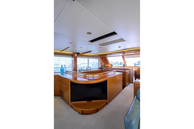  Yacht Photos Pics Luxurious interior of 1985 Feadship Yacht Fisherman with elegant wood finishes and modern design.