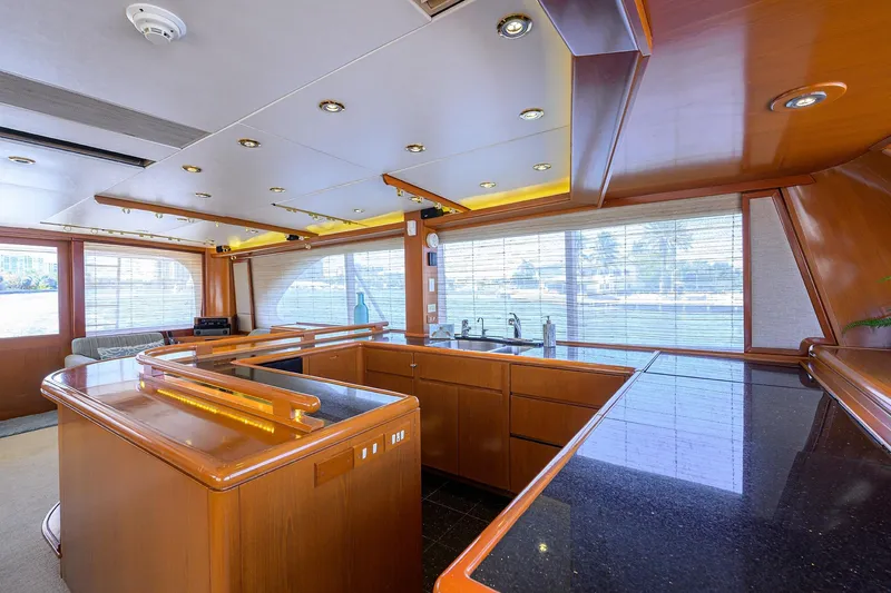  Yacht Photos Pics Luxurious 1985 Feadship Yacht Fisherman interior with modern kitchen and panoramic windows.