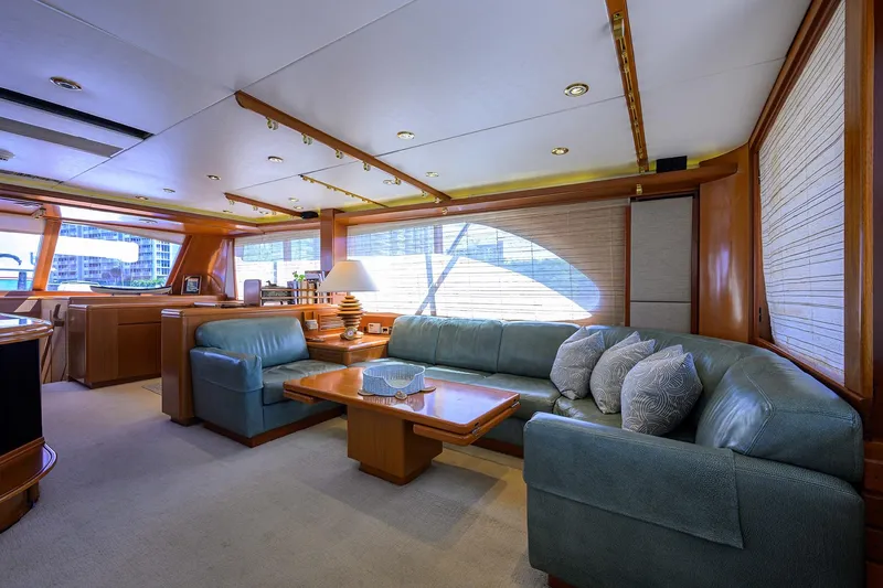  Yacht Photos Pics Luxurious 1985 Feadship Yacht Fisherman interior with elegant seating and wooden accents.