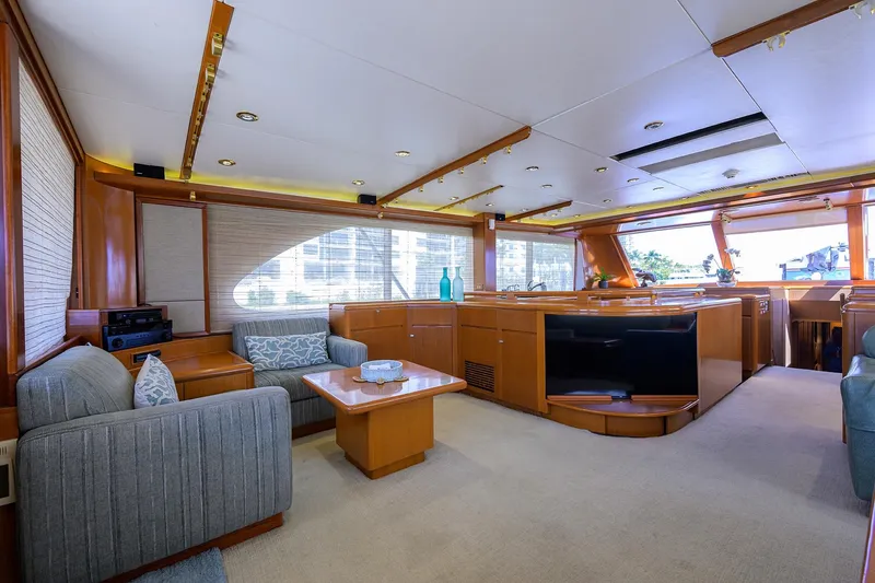 Yacht Photos Pics Luxurious interior of 1985 Feadship Yacht Fisherman with elegant wood finishes and modern furnishings.
