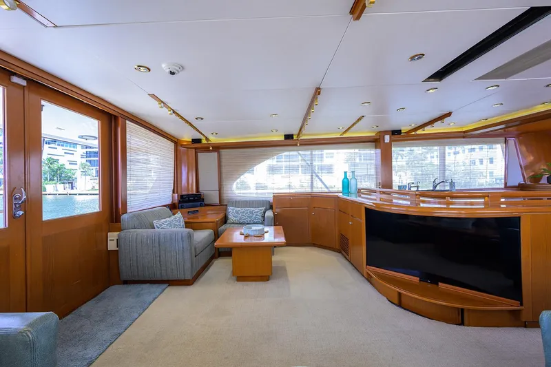  Yacht Photos Pics Luxurious interior of 1985 Feadship Yacht Fisherman with elegant wood finishes and modern amenities.