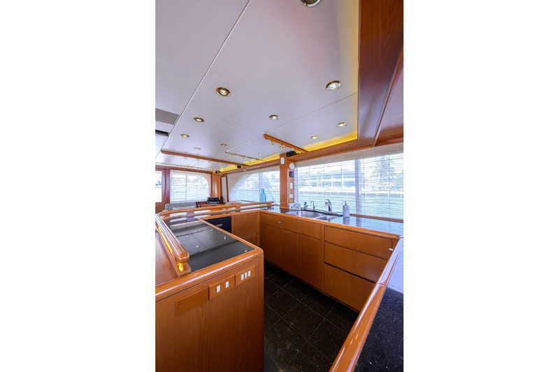  Yacht Photos Pics Luxurious 1985 Feadship Yacht Fisherman interior with sleek wood cabinetry and modern fixtures.
