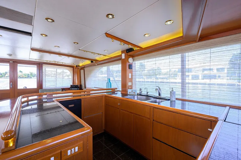  Yacht Photos Pics Luxurious 1985 Feadship Yacht Fisherman interior with modern kitchen and panoramic windows.