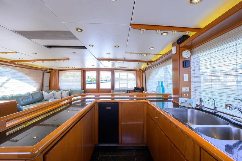  Yacht Photos Pics Luxurious interior of a 1985 Feadship Yacht Fisherman with modern kitchen and seating area.
