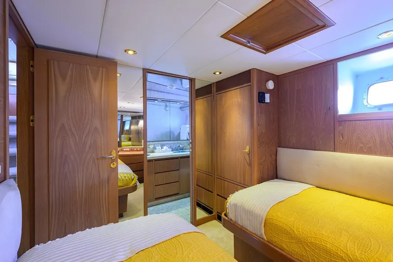  Yacht Photos Pics Luxurious 1985 Feadship Yacht Fisherman cabin with twin beds and wooden interior.